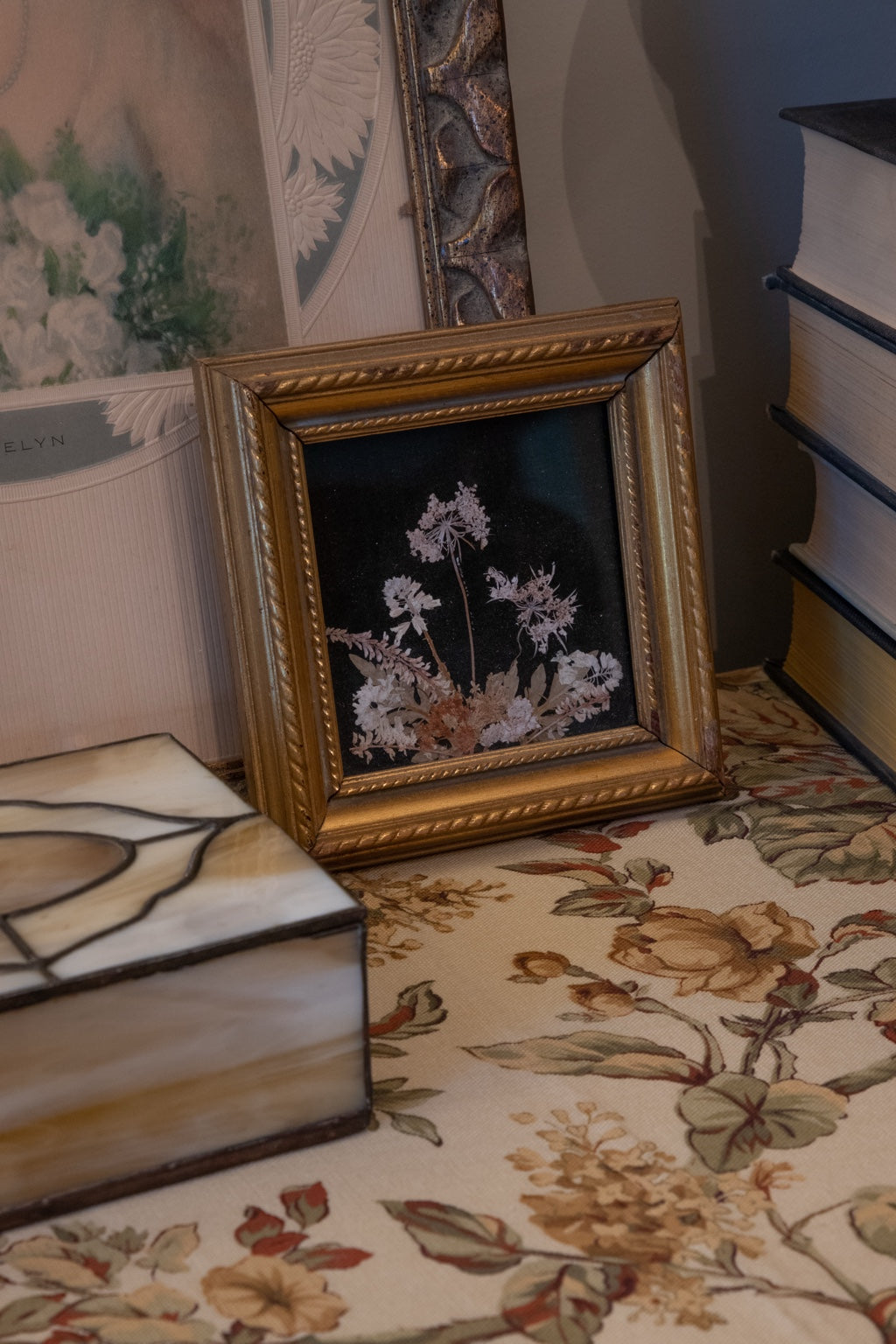 Small vintage framed picture of real New England flowers mounted on black velvet